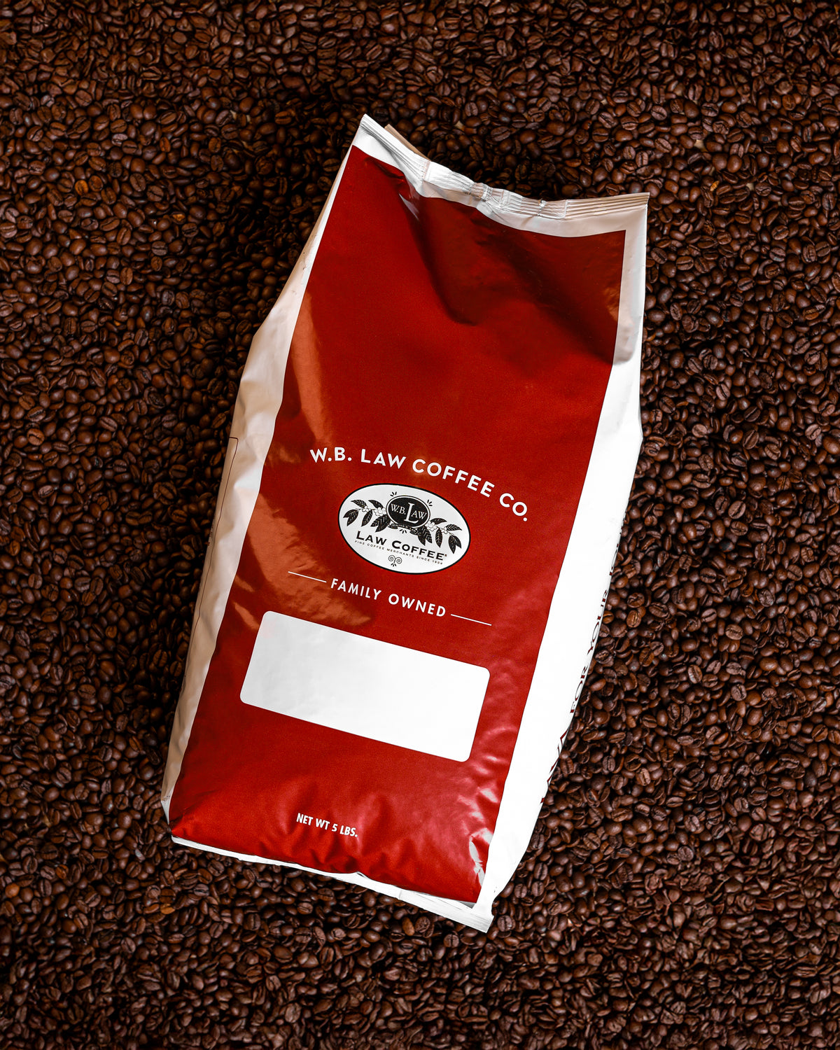 A 5lb bag of WB Law Coffee Dark Roast whole beans that brew a smooth, bold, smoky coffee.