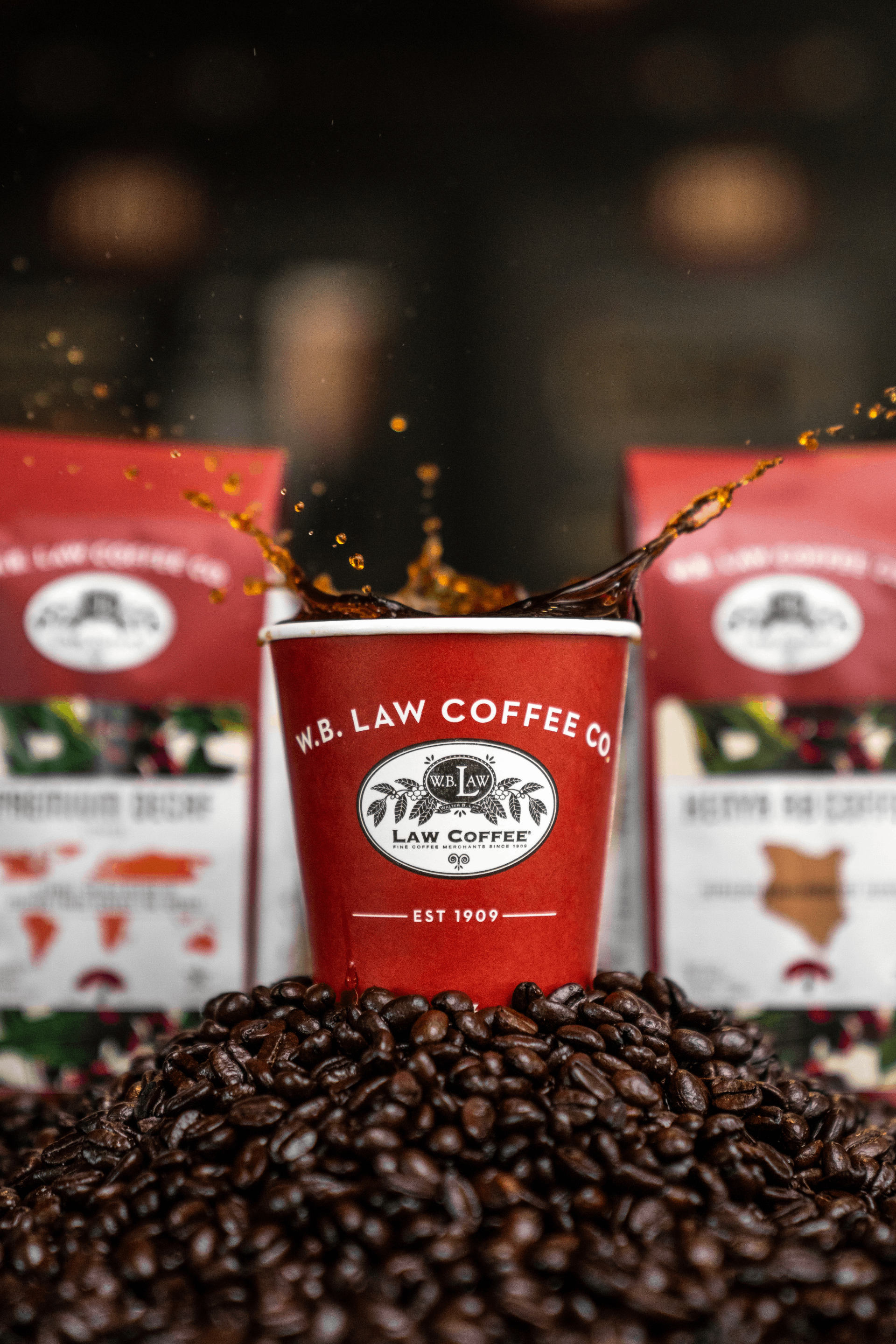 Coffee splashing out of a WB Law Coffee Cup