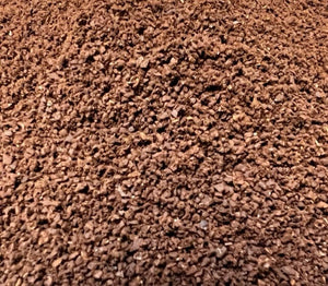 a pile of brown roasted and ground coffee.